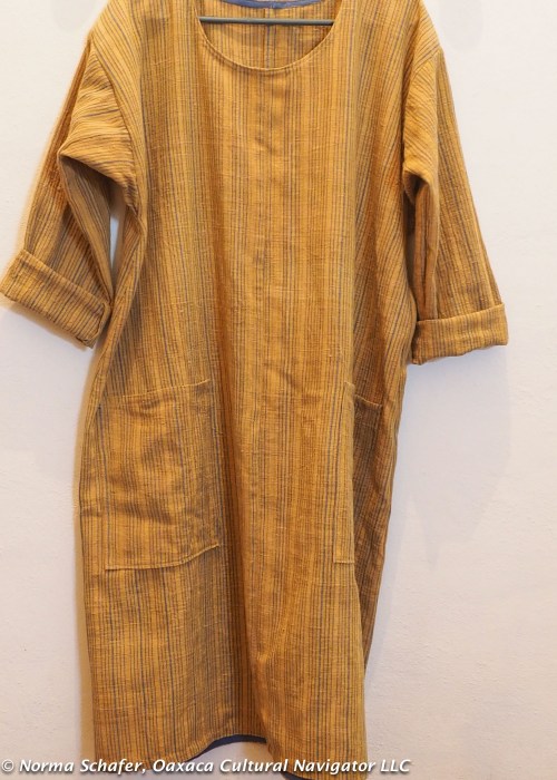 Dress with rolled sleeves and patch pockets.